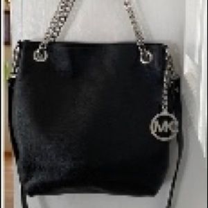 Authentic Michael Kors bag in black.